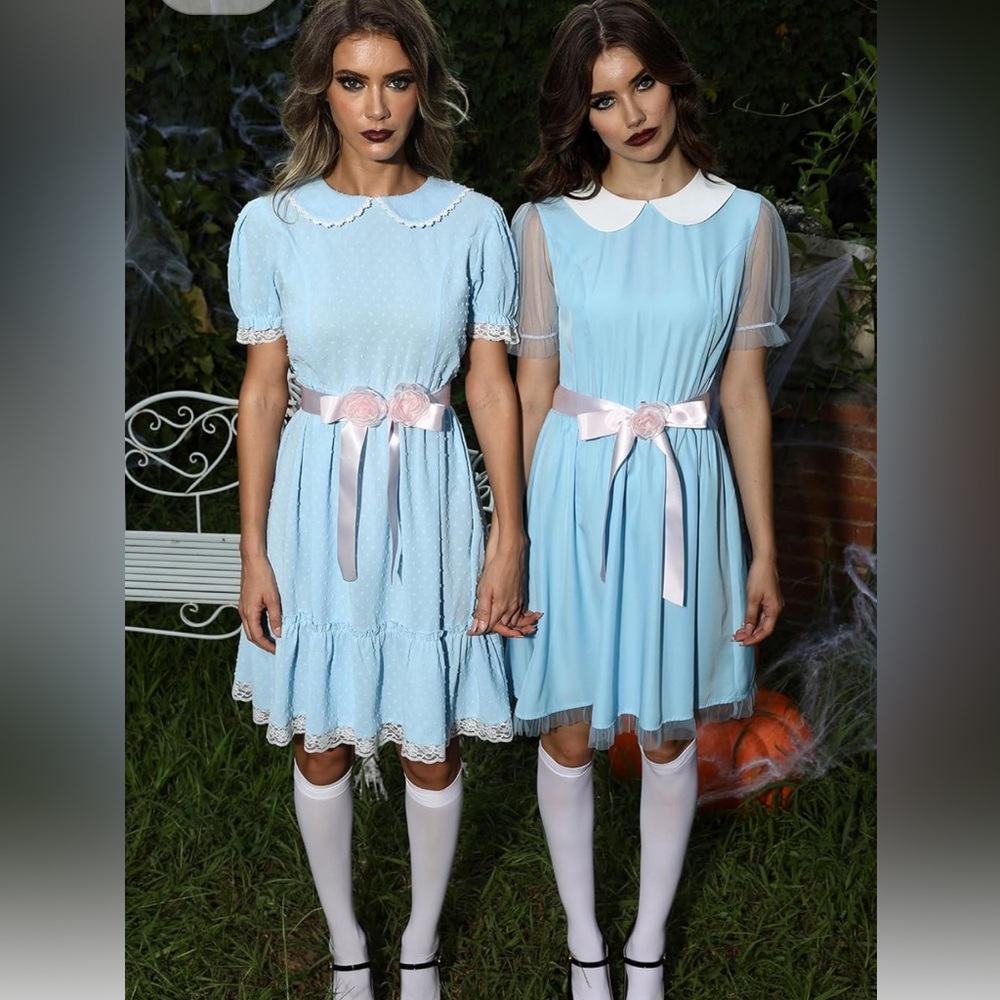 A pair of blue creepy twin Halloween costumes.